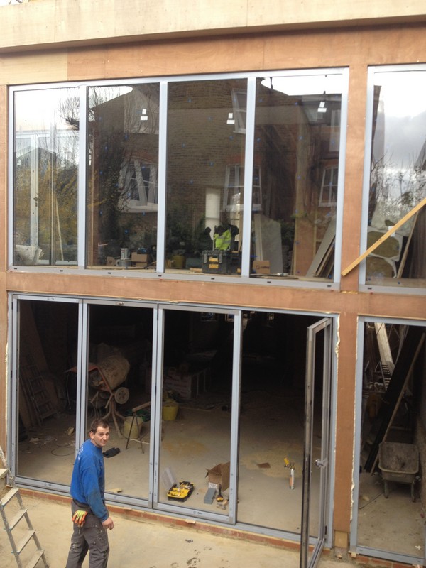 Aluminium bi-fold doors with two-storey glazing in Crystal Palace