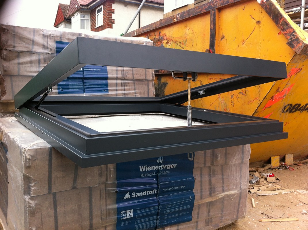 Opening flat roof skylight in anthracite grey installed in Crystal Palace