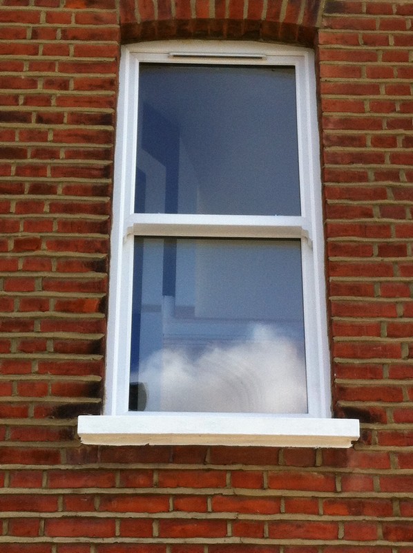 uPVC sash window on Victorian red brick house in Crystal Palace